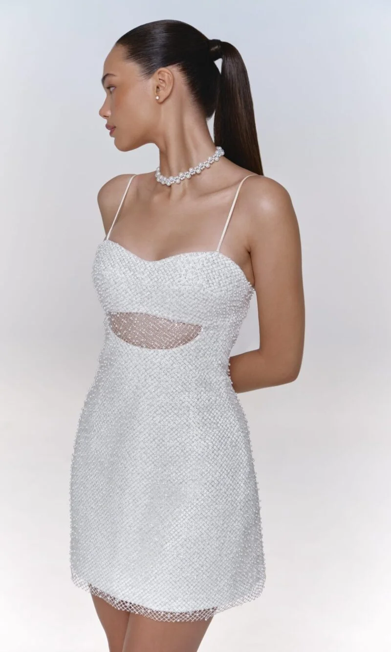 Pearl-adorned mini dress on straps, with cutout under chest